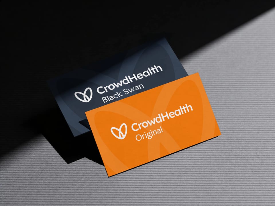 Two CrowdHealth cards in the new look: Original in orange, Black Swan in navy