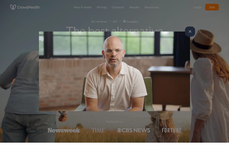 The home page with its member story video playing over it